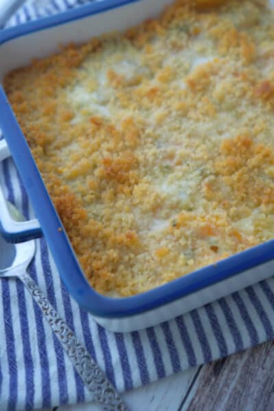 A closeup of a casserole dish with Butternut Squash Gratin.