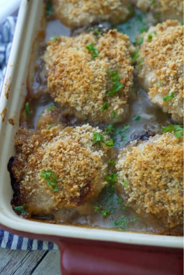 Chicken thighs baked in a casserole dish.