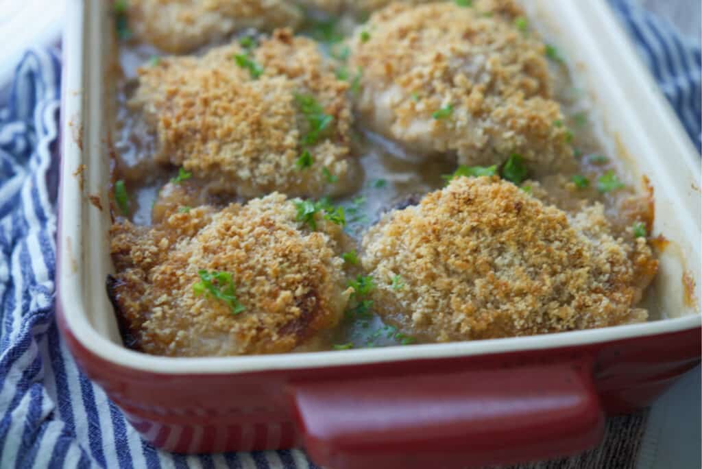 Chicken Vermont chicken thighs in a casserole dish. 