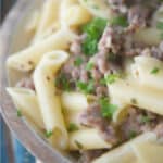 Gluten free pasta tossed with sweet Italian sausage in a mustard, white wine sage cream sauce is a delicious, quick weeknight meal.