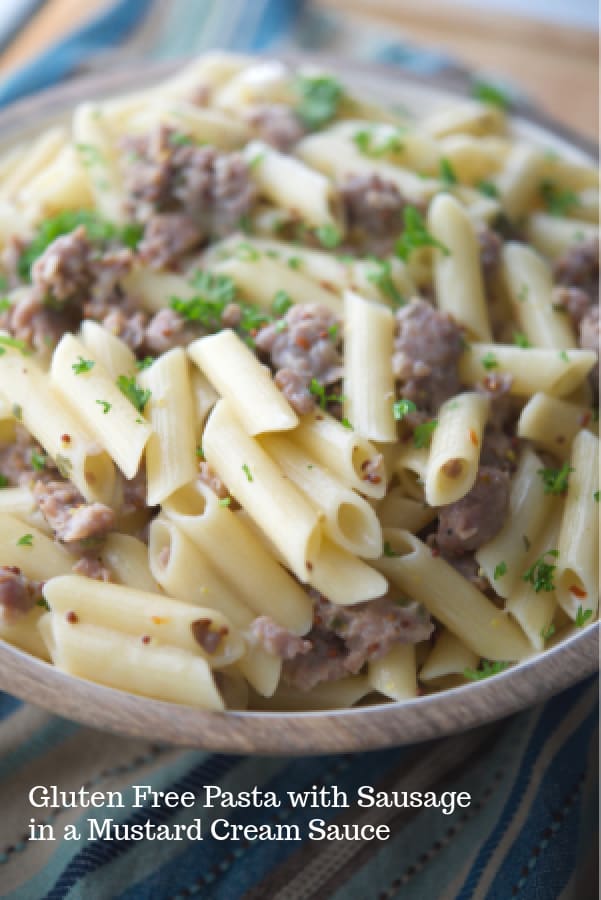 Gluten free pasta tossed with sweet Italian sausage in a mustard, white wine sage cream sauce is a delicious, quick weeknight meal. 