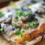 French bread pizza topped with a creamy parmesan sauce, roasted garlic, sautéed mushrooms and shredded Italian cheese blend.