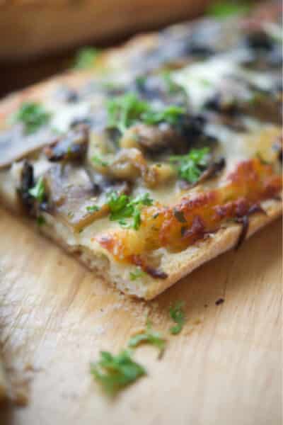 French bread pizza topped with a creamy parmesan sauce, roasted garlic, sautéed mushrooms and shredded Italian cheese blend.