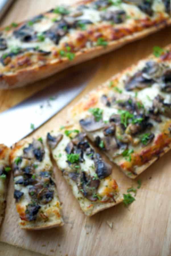 French bread pizza topped with a creamy parmesan sauce, roasted garlic, sautéed mushrooms and shredded Italian cheese blend.