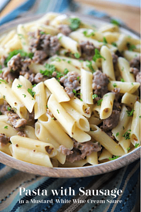a bowl of pasta with sausage