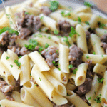 penne pasta with sausage in a bowl