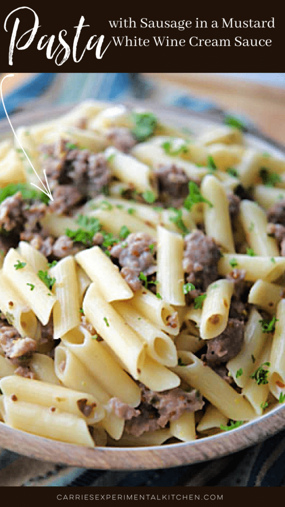 penne pasta with sausage in a bowl