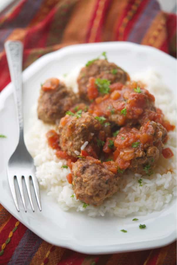 Mexican Meatballs made with ground beef, taco seasoning, pico de gallo and cheese are cooked in the crock pot for tasty weeknight dinner.