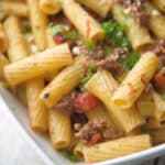 Rigatoni pasta tossed with a mirepoix of vegetables and spices in a fire roasted tomato meat sauce makes the perfect quick, weeknight meal. 