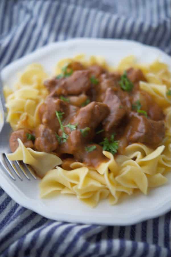 Beef Bourguignon made with beef cubes, pearl onions and mushrooms in a Cognac, red wine brown gravy is comfort food at its best. 