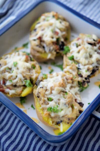 Antipasto Twice Baked Potatoes in white and blue dish.