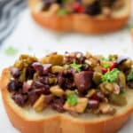 Olive Tapenade made with a variety of black and green olives like Kalamata, Pimento, Garlic and Sicilian make a tasty appetizer.