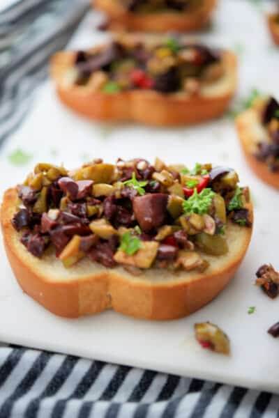 A plate of food, with Olive and Tapenade