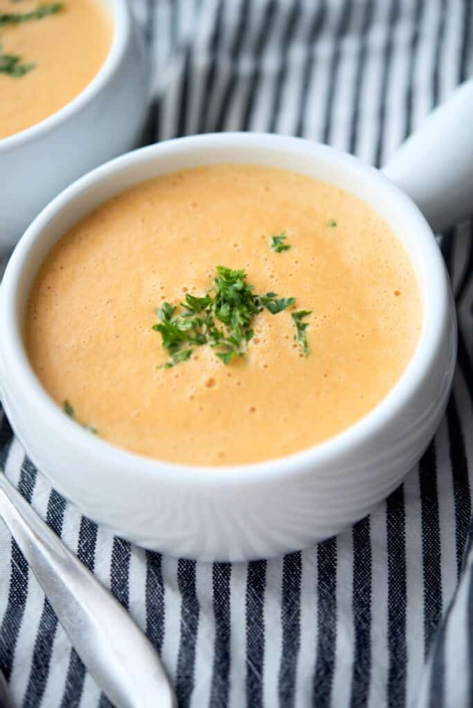 This Shrimp Bisque recipe made with a mirepoix of vegetables, shrimp, sweet Moscato wine, spices and heavy cream is deliciously creamy. 