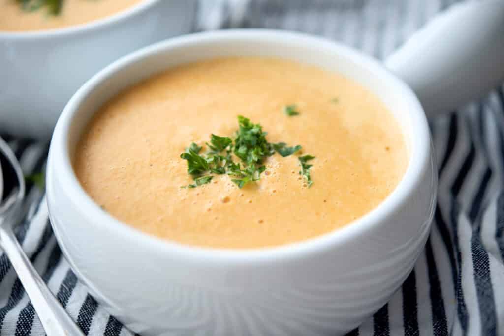 A close up of Shrimp Bisque in a white bowl. 