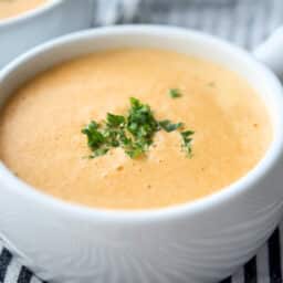 A close up of Shrimp Bisque in a white bowl.