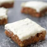 These Carrot Cake Bars made with fresh grated carrots, chopped walnuts and homemade cream cheese icing are deliciously moist. 