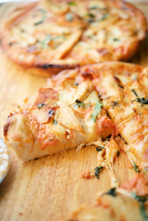 Drunken Deep Dish Pizza with Grilled Chicken on a wooden cutting board