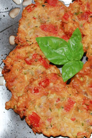 Greek Tomato Zucchini Fritters made with tomatoes, zucchini, fresh mint, basil and self rising flour, make a tasty side dish