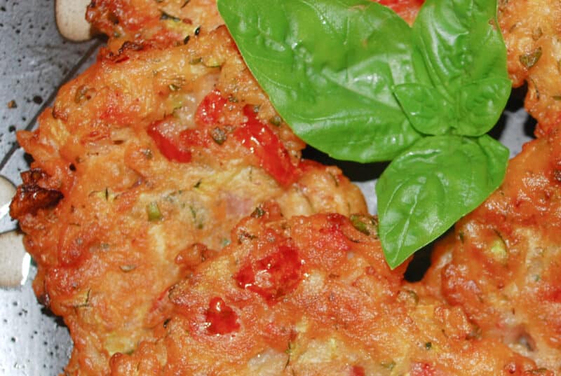 Greek Tomato Zucchini Fritters made with tomatoes, zucchini, fresh mint, basil and self rising flour, make a tasty side dish
