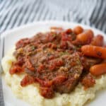 Oven roasted beef brisket made Italian style with oregano, garlic and fire roasted tomatoes makes a tasty, comforting family meal.