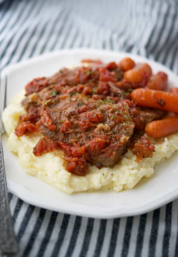 Italian Style Beef Brisket on top of mashed potatoes