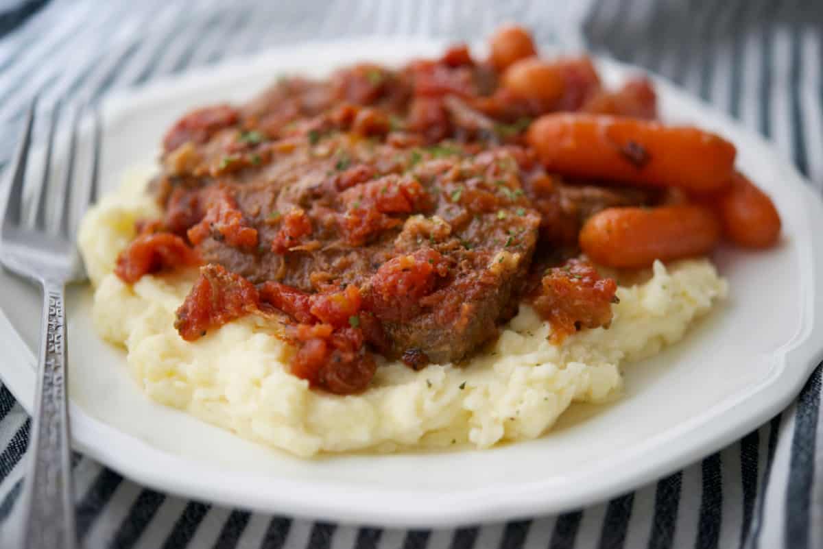 Italian Style Beef Brisket with carrots and mashed potatoes.