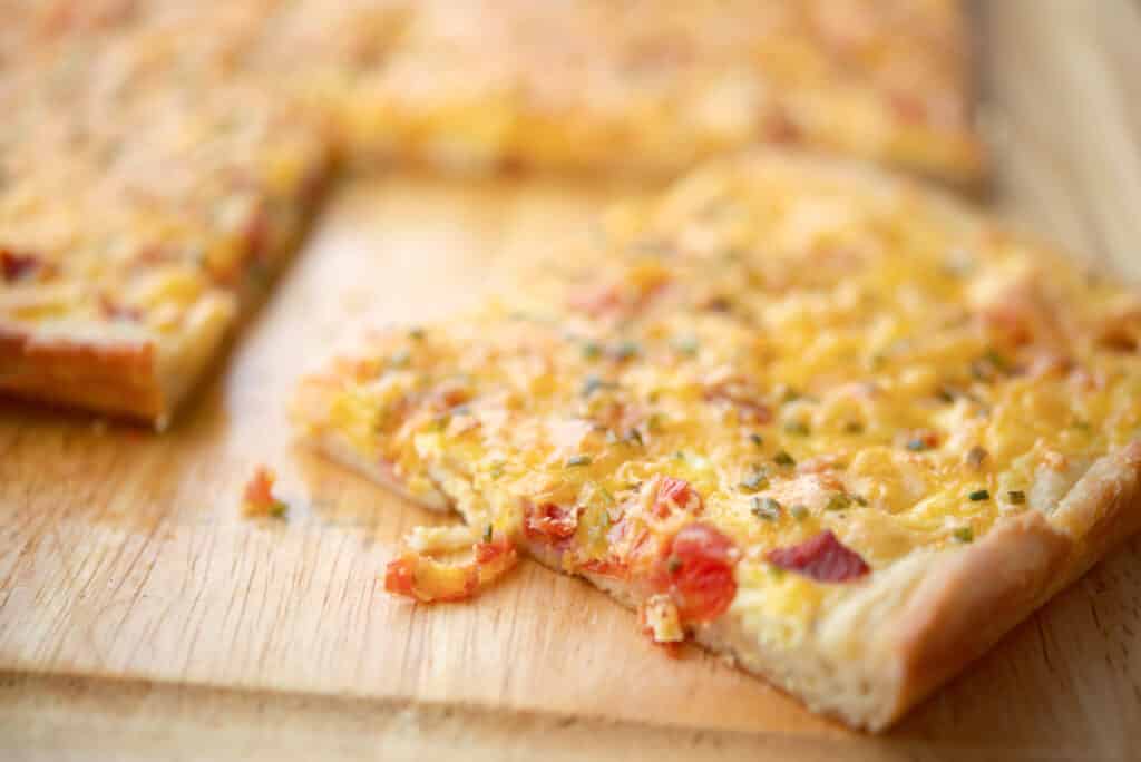 Portuguese Breakfast Pizza with chourico, eggs and potatoes.