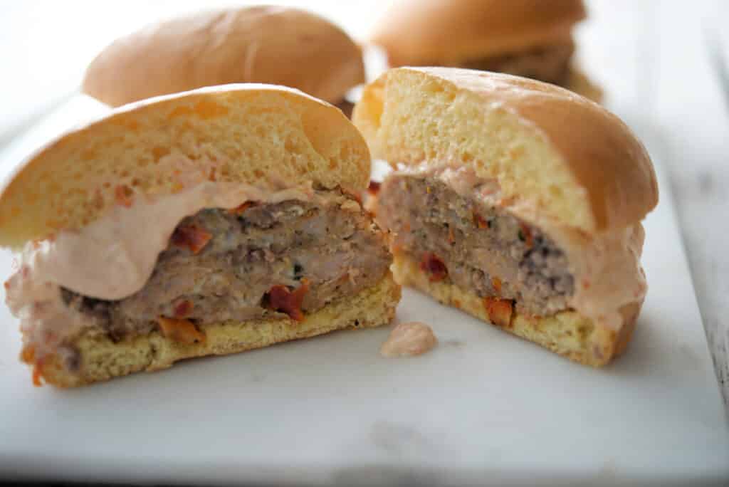 Calabrese Patties on a bun cut in half. 