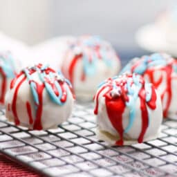 Cake balls on a cooling rack.