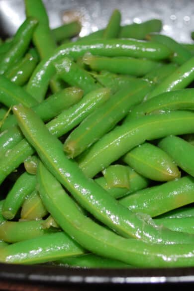 Fresh green beans steamed; then sautéed with butter, chicken and beef broth, Kosher salt and black pepper will be your new favorite vegetable. 
