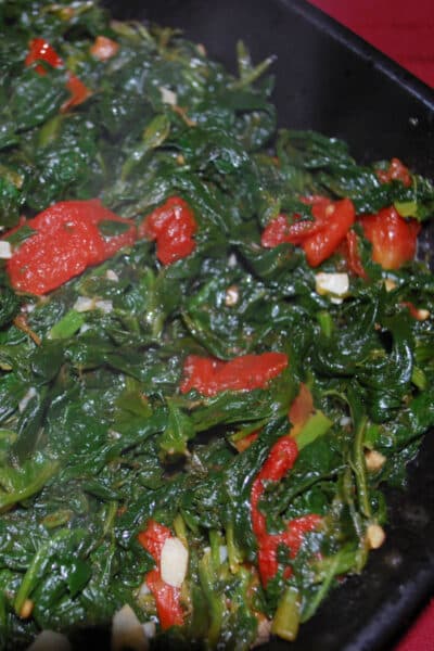 Spinach sautéed with roasted plum tomatoes, garlic and Extra Virgin Olive Oil makes a tasty vegetable side dish to any meal. 