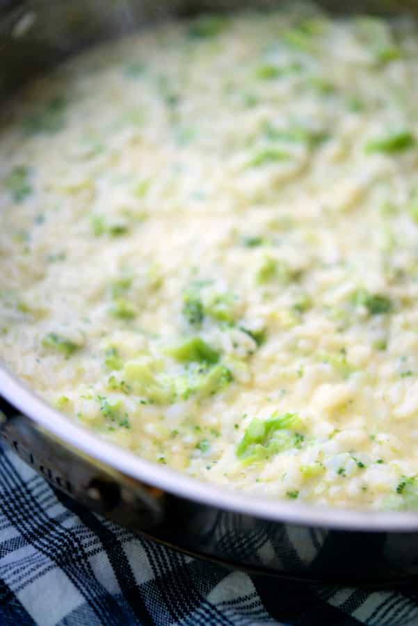 Broccoli and Cheese Risotto in a stainless steel skillet