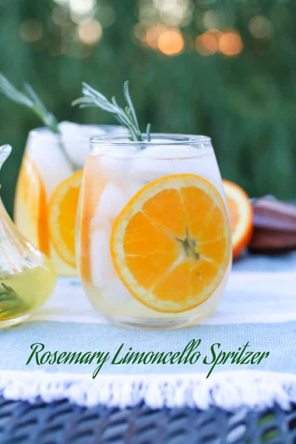 Rosemary Limoncello Spritzer in a glass with orange slice.