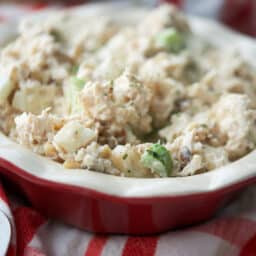 A close up of chicken salad in a red bowl