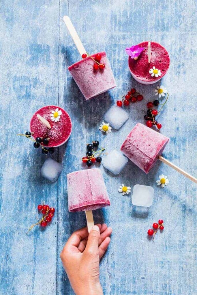 Watermelon Popsicles on a wooden table