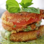 Heirloom tomatoes breaded in Italian breadcrumbs; then pan fried and topped with a fresh basil pesto crema. 