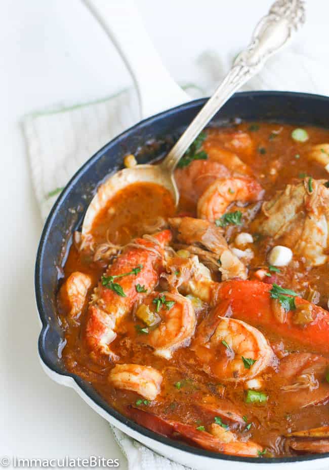 Gumbo Stew in a pot with a spoon.