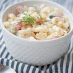 Dill Macaroni Salad made with English cucumbers, tomatoes and a sour cream and fresh dill dressing is super tasty. 