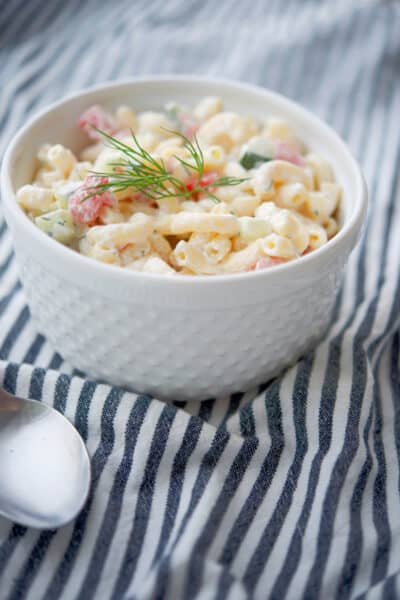 Dill Macaroni Salad made with English cucumbers, tomatoes and a sour cream and fresh dill dressing is super tasty. 