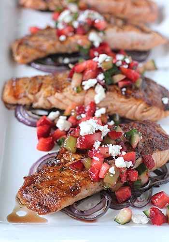 A plate of food, with Grilled salmon and Onion