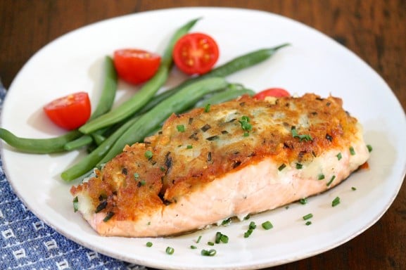 A plate of food on a table, with Salmon and Potato