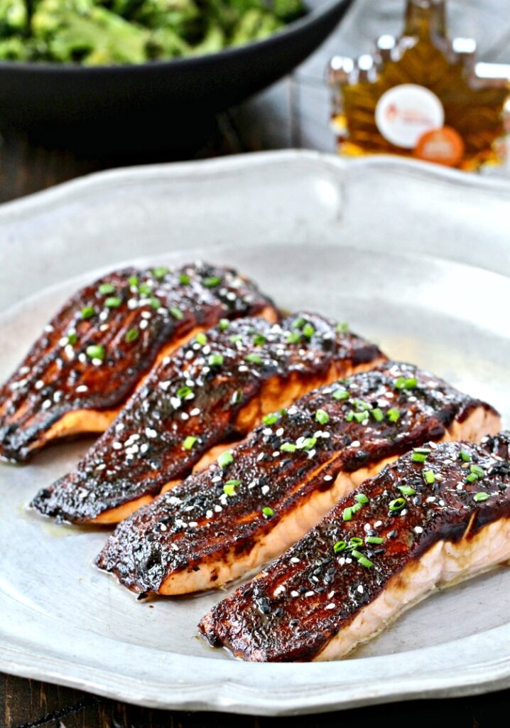 A plate of food Miso Salmon.