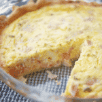 Ham and Cheese Quiche made with farm fresh eggs, heavy cream, diced ham, shredded Cheddar cheese and chives. 