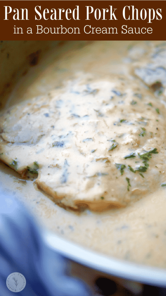 Bone-in center cut pork chops pan seared in a skillet on top of the stove smothered in a rich bourbon cream sauce. 