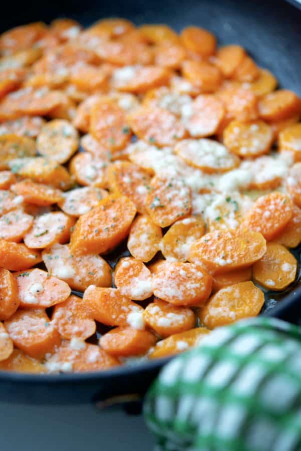 Parmesan Braised Carrots in a pan