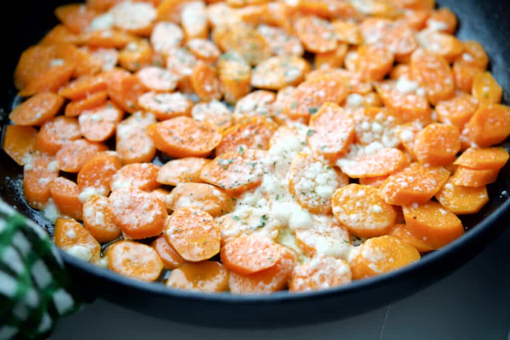 Closeup of Parmesan Carrots in a pan