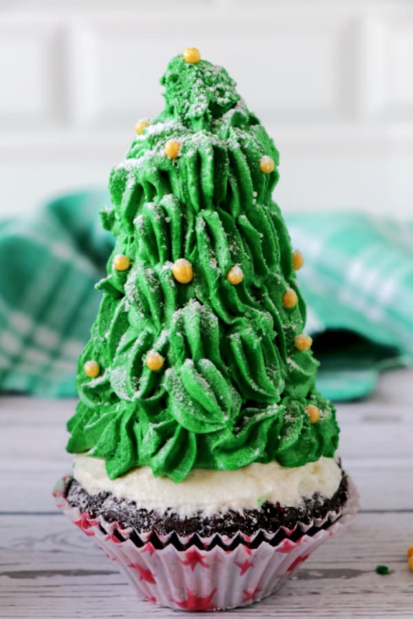 Christmas Tree Cupcakes made with box cake mix, homemade buttercream icing and fun sprinkles make a fun, festive holiday treat!