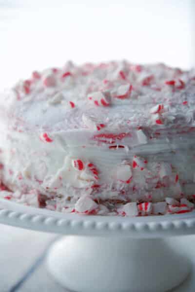 Whole Peppermint Layer Cake on a white cake stand
