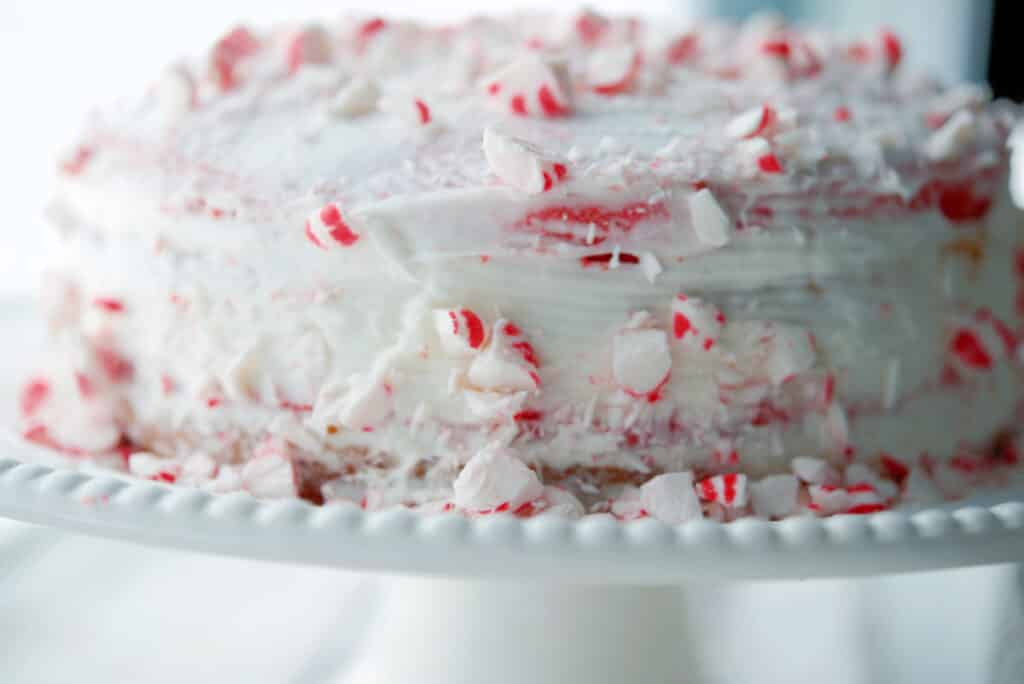 Horizontal image of a whole peppermint layer cake. 